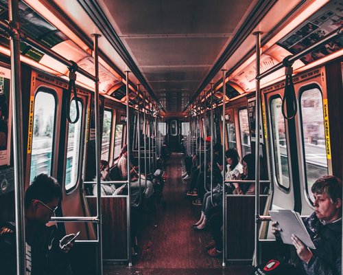 People commuting in a modern city transit system during daylight